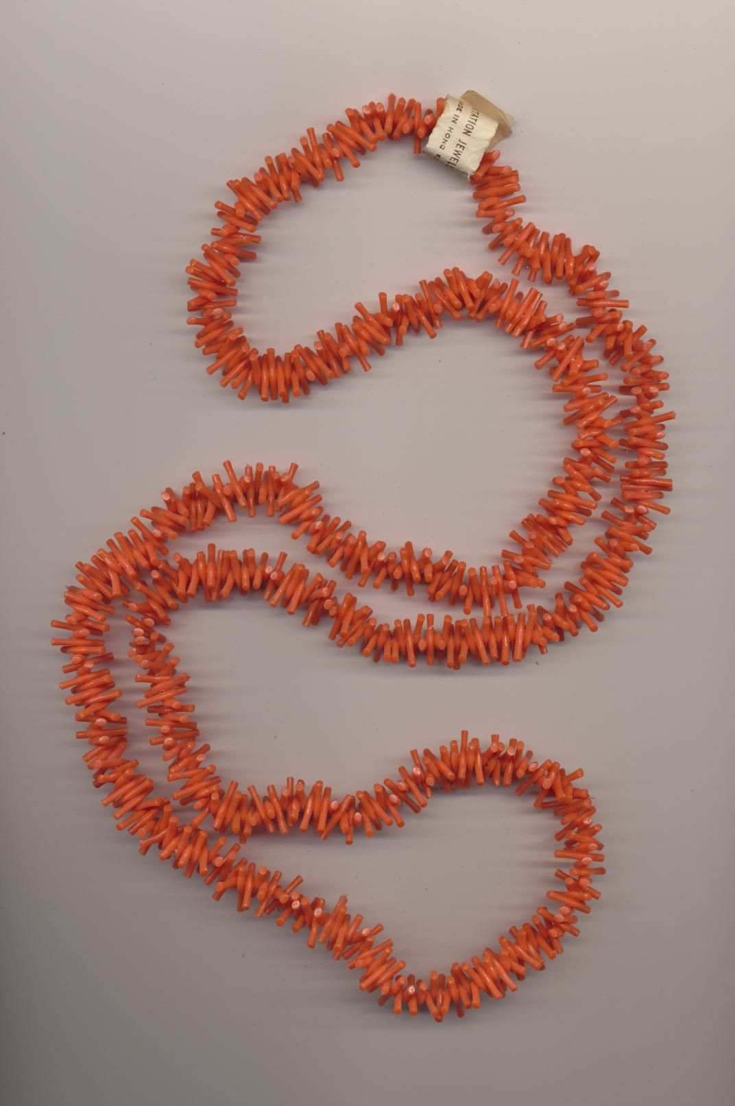 Necklace made of plastic imitation red branch coral, made in Hong Kong, 1980's, length 41'' 104cm.
